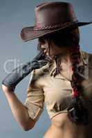 Cowboy woman with a glove in his hand
