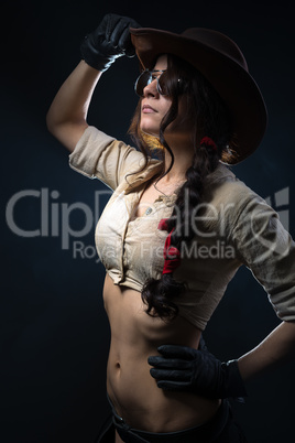 Beautiful cowgirl  on a gray background