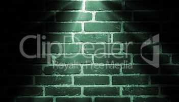 spot light green on brick wall