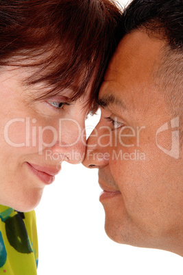 Middle age couple with forehead together.