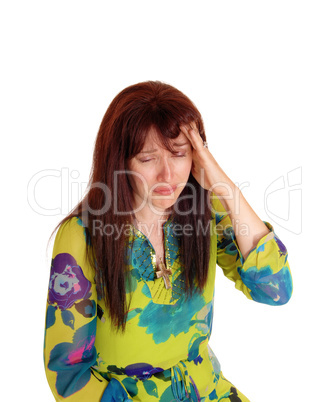 Crying woman with bad headache.