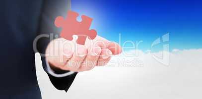 Composite image of mid section of a businessman with hands out