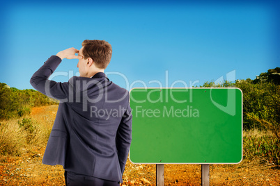 Composite image of wear view of businessman looking away