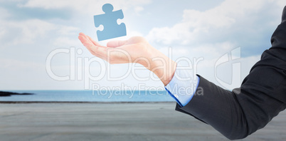 Composite image of close up of businessman with empty hand open