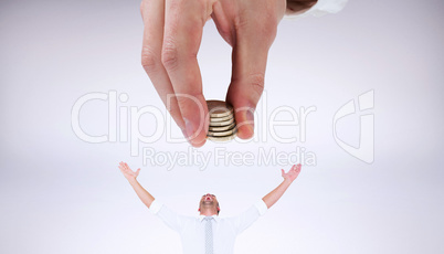 Composite image of businessman counting his coins at desk