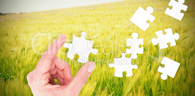 Composite image of businessman measuring something with his fing