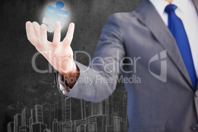 Composite image of businessman presenting with his hands