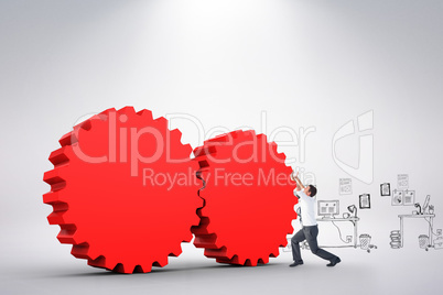Composite image of businessman bending and pushing