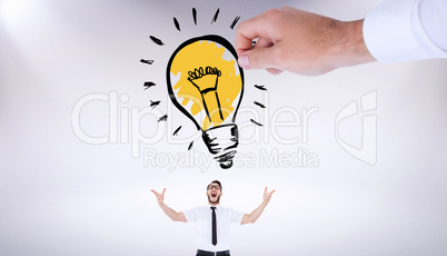 Composite image of hand drawing light bulb