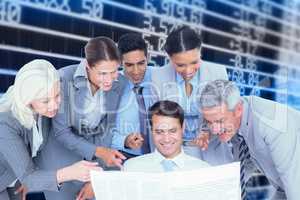 Composite image of happy business people looking at newspaper