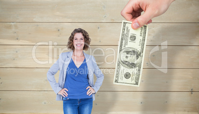 Composite image of businesswoman looking at camera with hands on