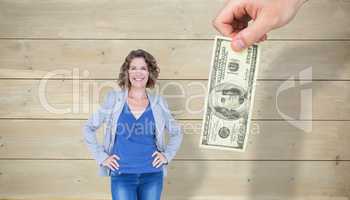 Composite image of businesswoman looking at camera with hands on