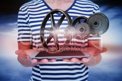 Composite image of close up of man holding tablet