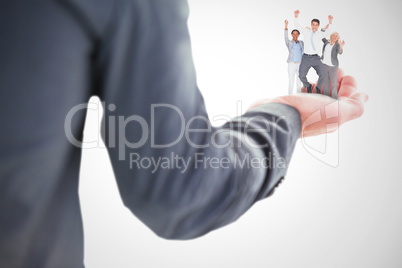 Composite image of business people cheering in office