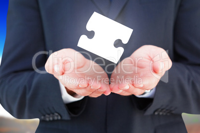 Composite image of close up of hand of a businessman