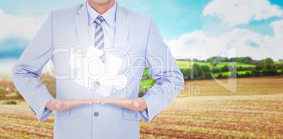 Composite image of businessman walking while gesturing with hand