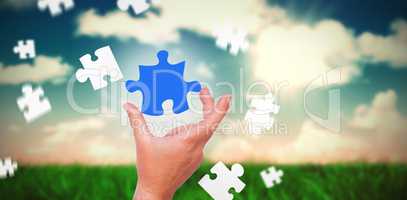 Composite image of businessman pointing with his finger