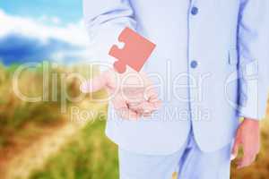 Composite image of handsome businessman gesturing with hands