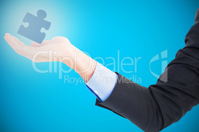 Composite image of close up of businessman with empty hand open