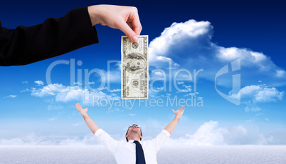 Composite image of businesswomans hand holding hundred dollar bi