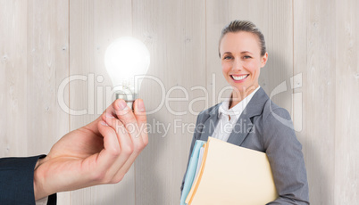 Composite image of smiling businesswoman