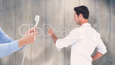 Composite image of handsome man pointing something with his fing