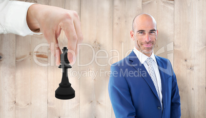 Composite image of businessman smiling at the camera