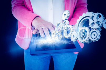 Composite image of elegant brunette using tablet Composite image of elegant brunette using tablet