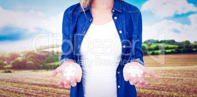 Composite image of woman presenting her hands