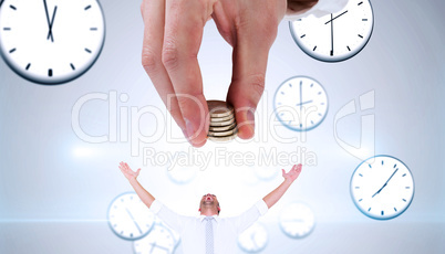 Composite image of businessman counting his coins at desk