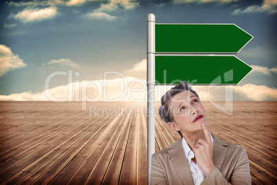 Composite image of businesswoman thinking