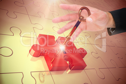 Composite image of businessman holding hand out