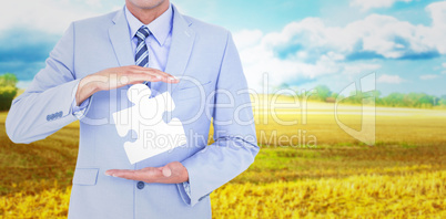 Composite image of handsome businessman gesturing with hands