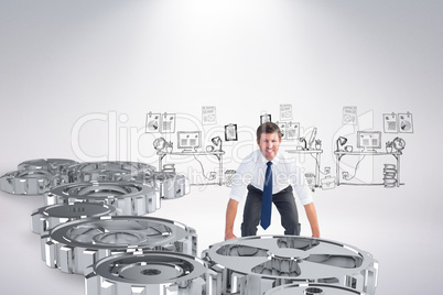 Composite image of businessman bending and lifting