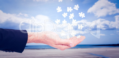 Composite image of close up of businessman with empty hand open