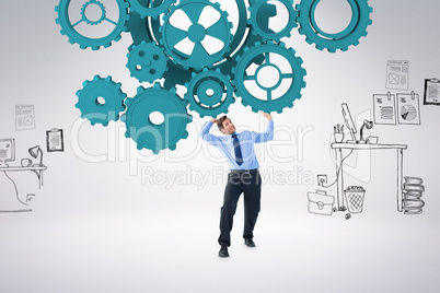 Composite image of focused businessman lifting up something heav