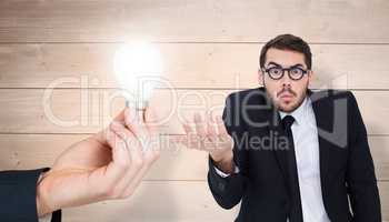 Composite image of doubtful businessman with glasses gesturing