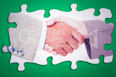 Composite image of side view of business peoples hands shaking