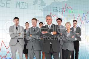 Composite image of business team standing arms crossed