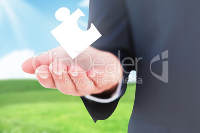 Composite image of mid section of a businessman with hands out Composite image of mid section of a businessman with hands out