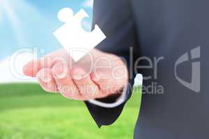 Composite image of mid section of a businessman with hands out