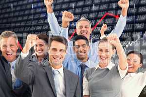 Composite image of business people cheering in office