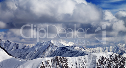 Winter sunlight mountains in clouds