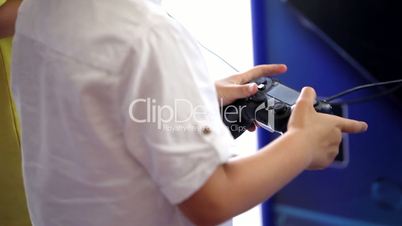 Playing games console close up, man playing video game with joystick