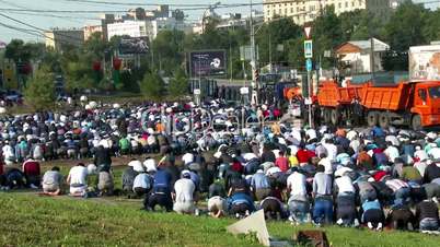 Muslims prayers on celebration of Eid al-Fitr (Uraza-Bairam). Crowd of migrants from Central Asia in Moscow, Russia