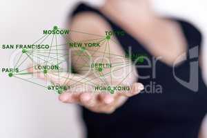 Hand holding network with city names