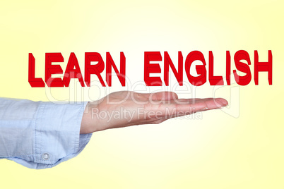Hand holding lettering "LEARN ENGLISH"