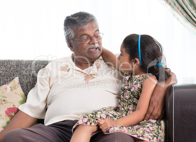 Grandfather and granddaughter communicating