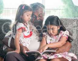 Family reading book together
