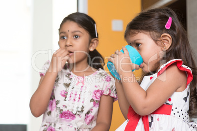 Children eating and drinking